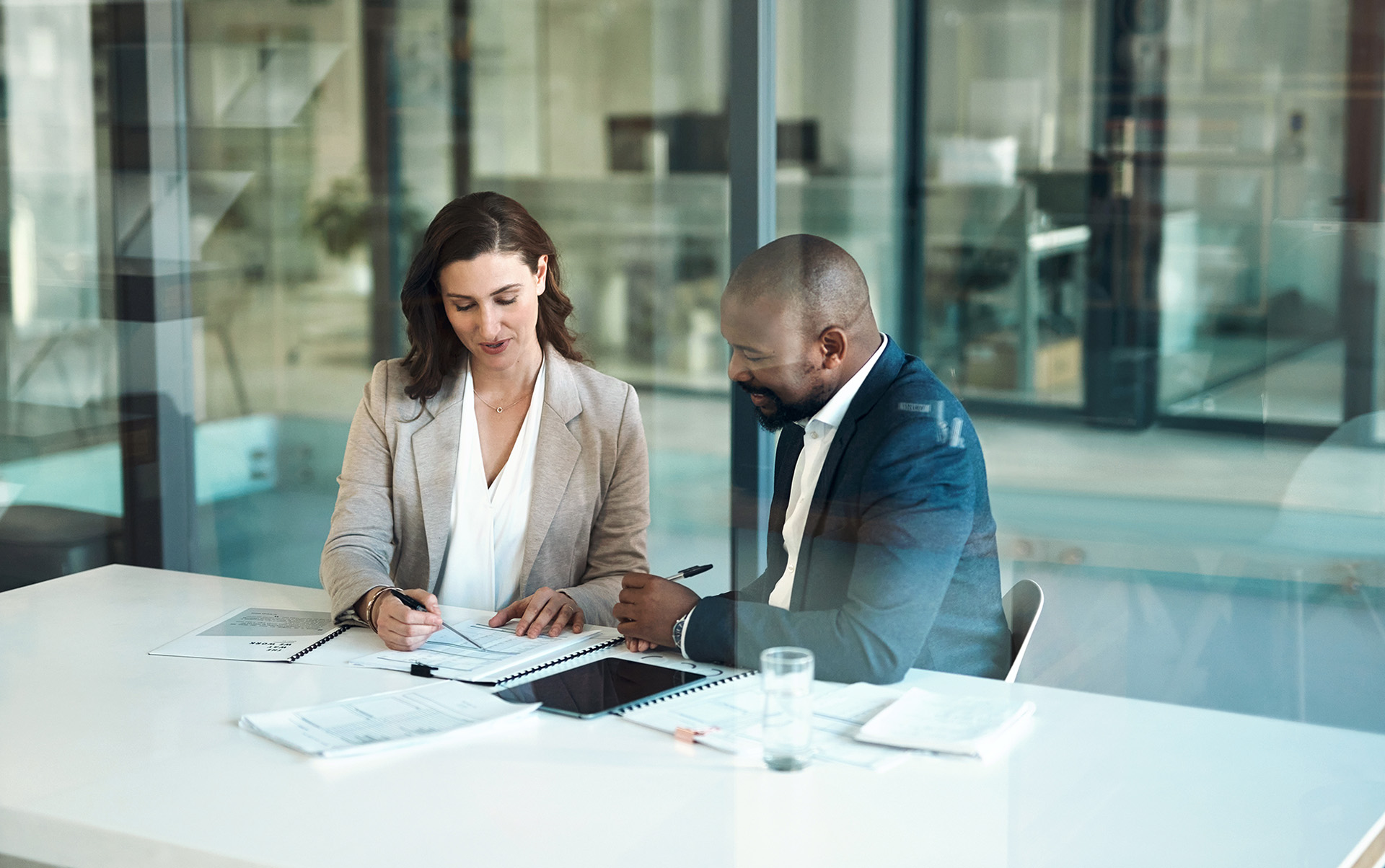 Two business people looking over a document